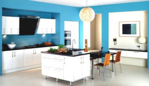 Blue kitchen with white cabinets