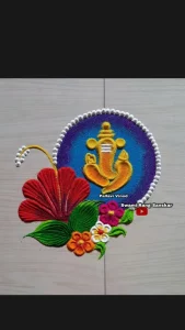 Red and white Ganesh Rangoli design