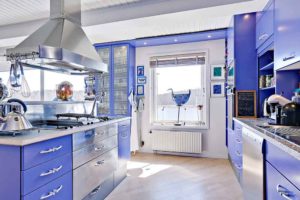 Spectacular blue kitchen with modern chimney