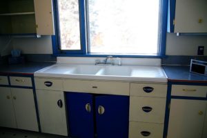 classy blue white kitchen with marble counter top