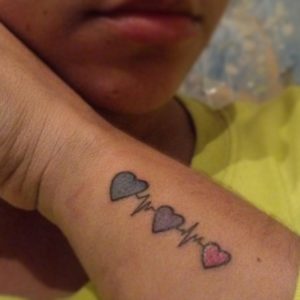 sister heartbeats tattoo