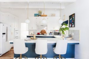 white theme kitchen with a touch of blue and brass