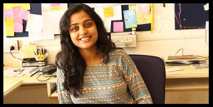 women entreprepreneur aditi gulta sitting on her desk